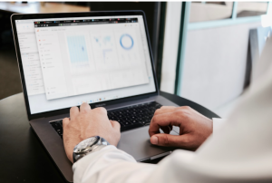 A data analyst looks over data reports.